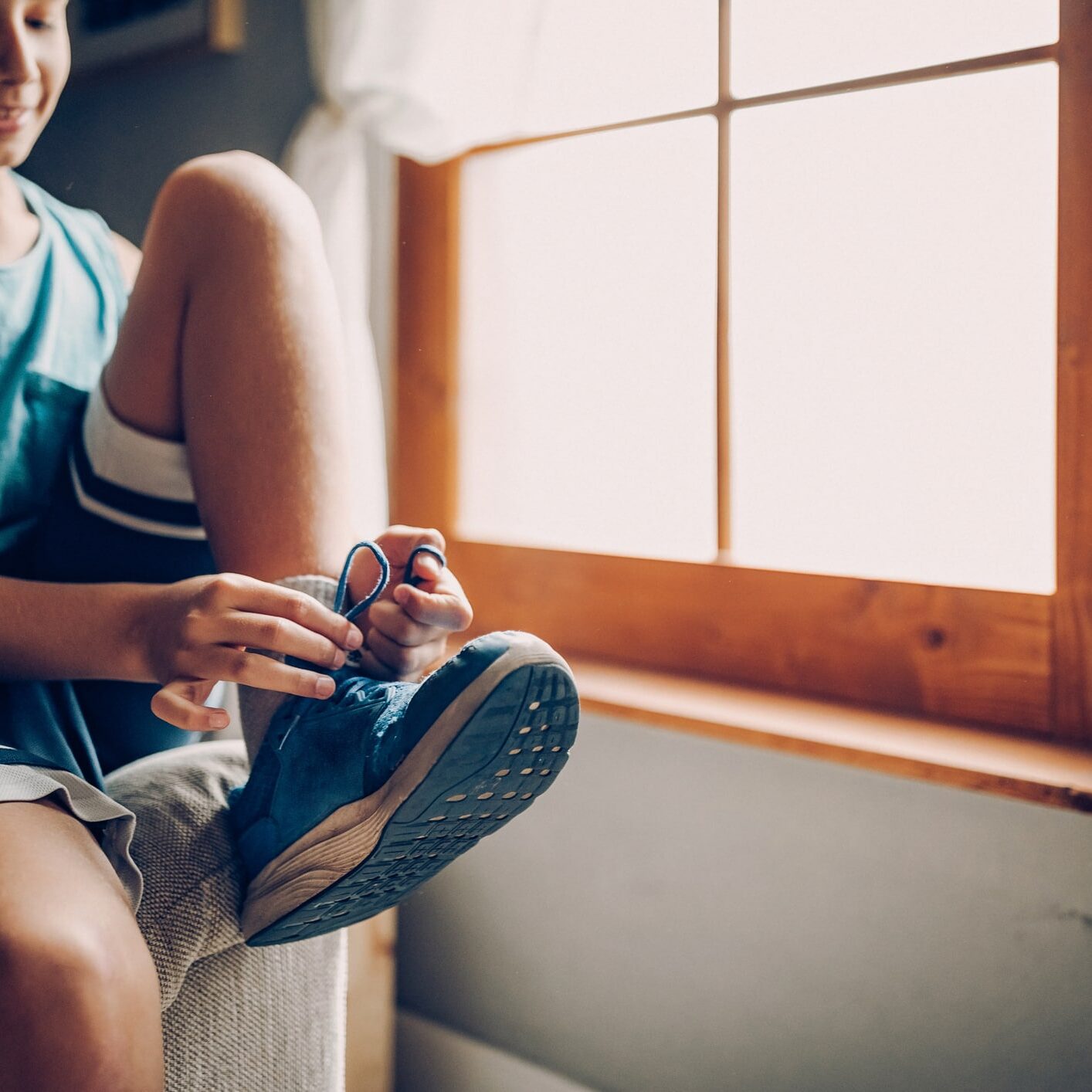 Kid in his room preparing hanging out with friends on sports field